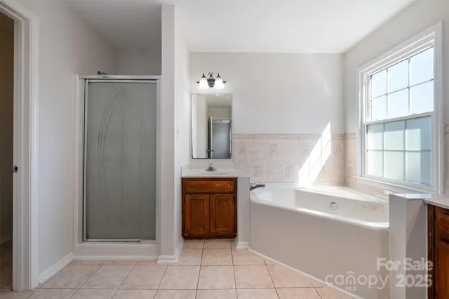 a bathroom with a bathtub and a sink