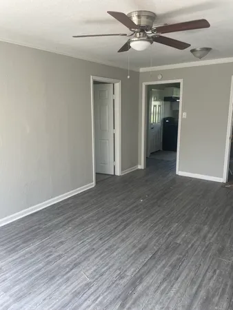 a white toilet sitting next to a bath tub
