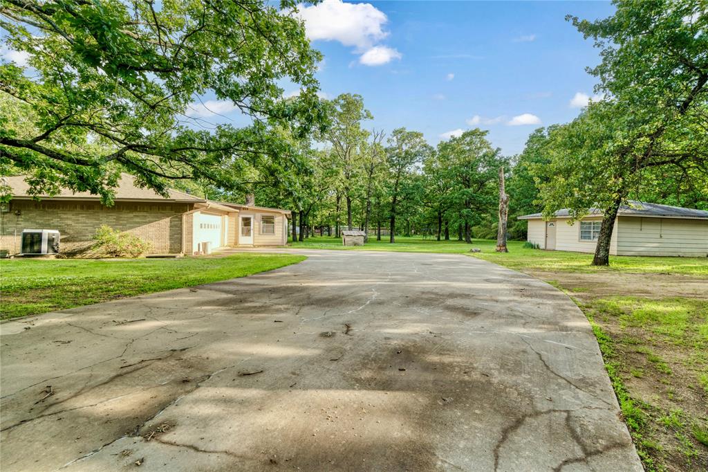64 Farm Road 2121 Paris, TX 75462 - Photo 19 of 34 Driveway/Garage area for main residence. Front of guest house
