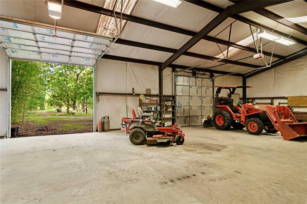 64 Farm Road 2121 Paris, TX 75462 - Photo 30 of 34 Inside of metal shop with overhead door open