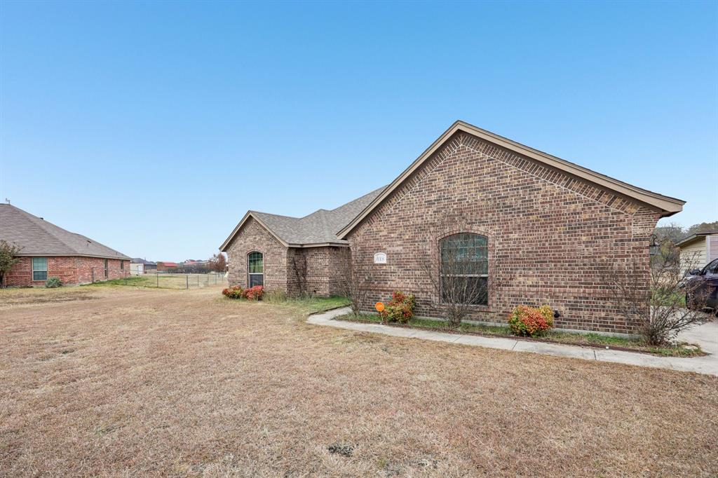 118 Kenya Court Springtown, TX 76082 - Photo 3 of 35 a view of a house with a yard