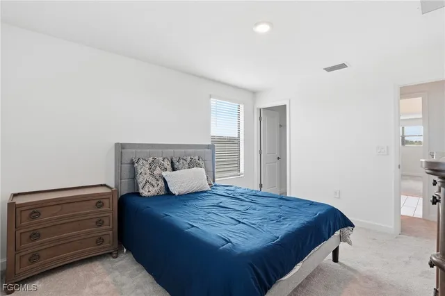 a bedroom with a bed and closet