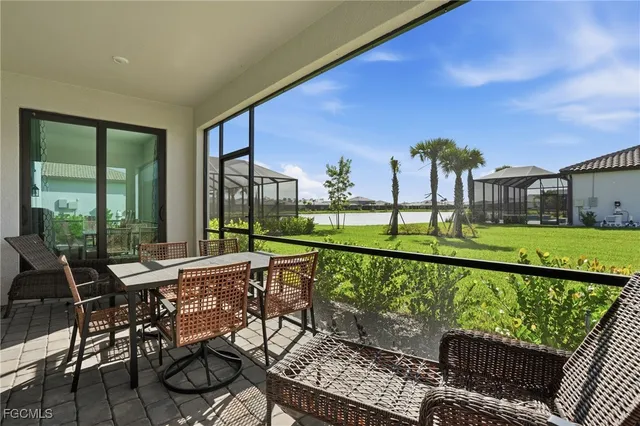 a view of a chair and tables in the balcony