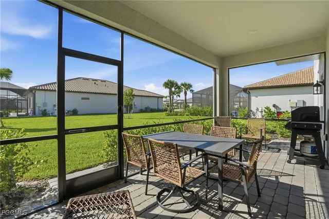 a table and chairs in front of a building