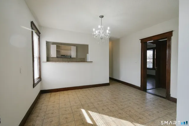 a view of a hallway with a chandelier