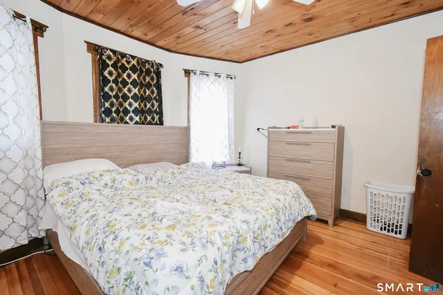 a bedroom with a bed and a dresser