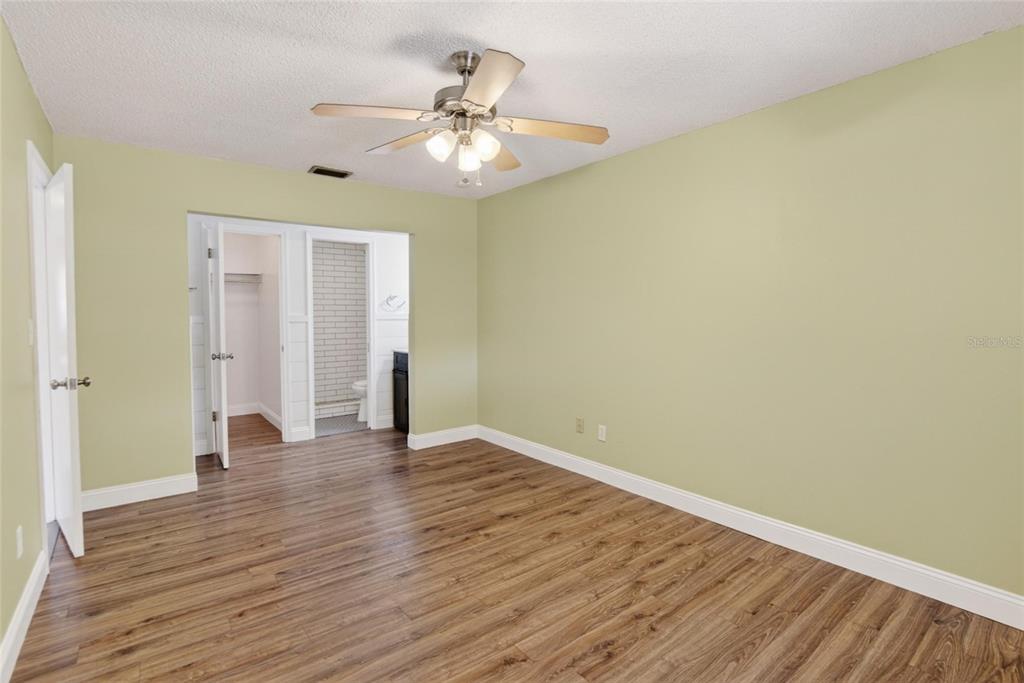 2340 Merrily Circle South Seffner, FL 33584 - Photo 17 of 52 a view of an empty room with wooden floor