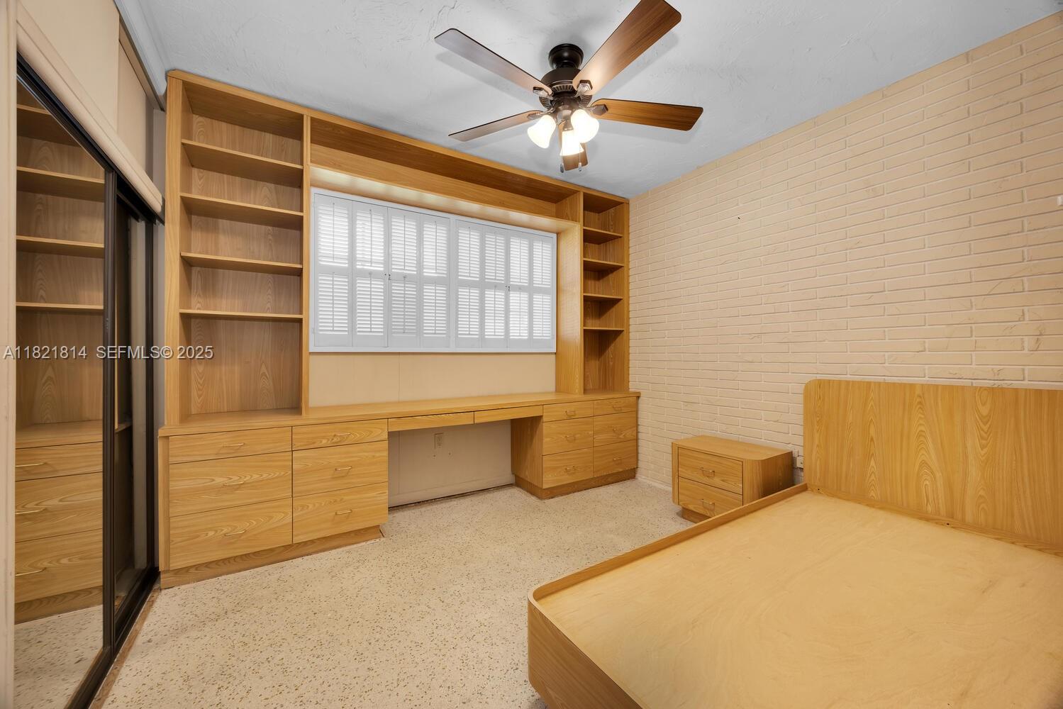 5025 Southwest 90th Court Miami, FL 33165 - Photo 11 of 18 a bedroom with a bed and a chandelier