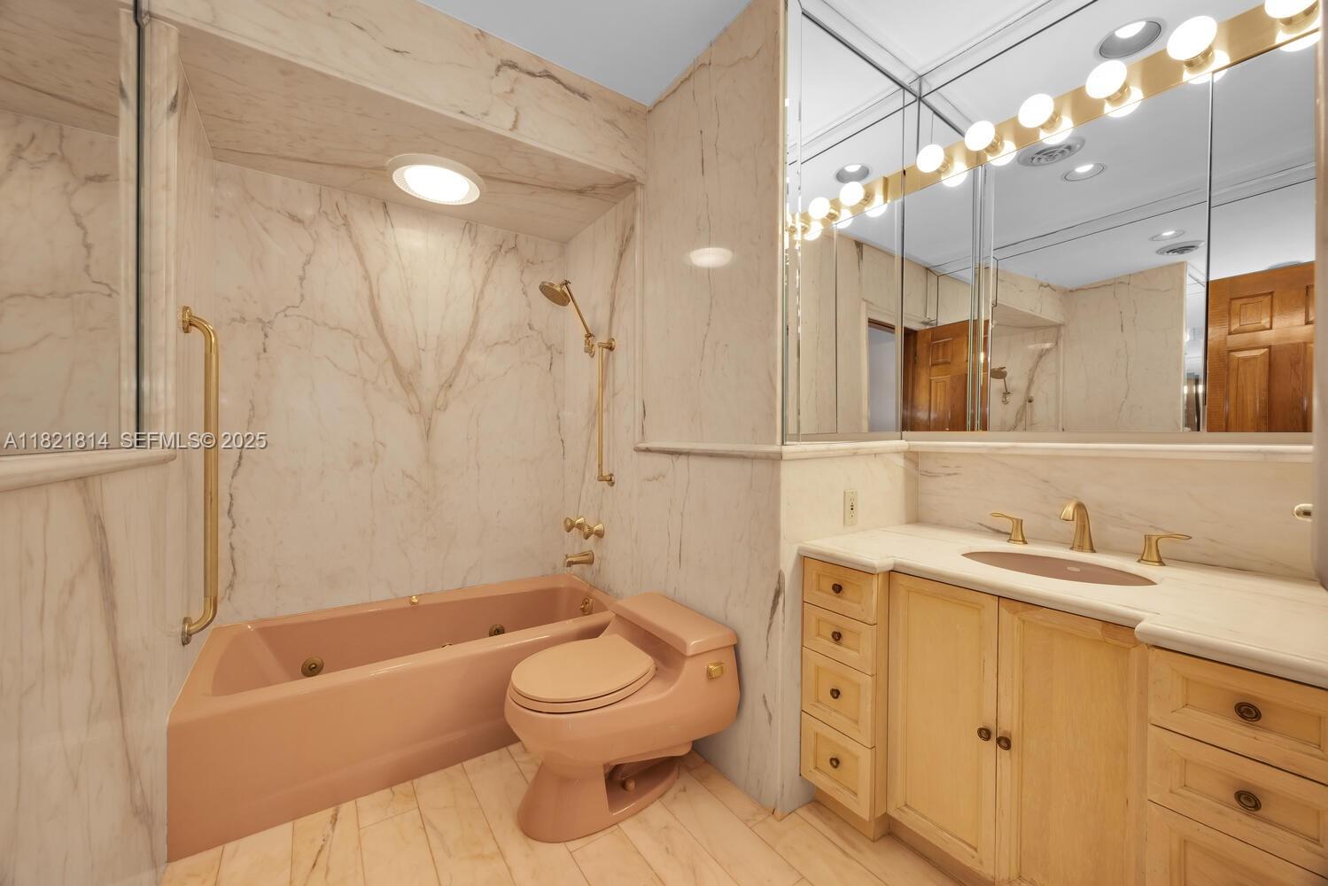 5025 Southwest 90th Court Miami, FL 33165 - Photo 12 of 18 a bathroom with a toilet a sink a mirror a bathtub and vanity