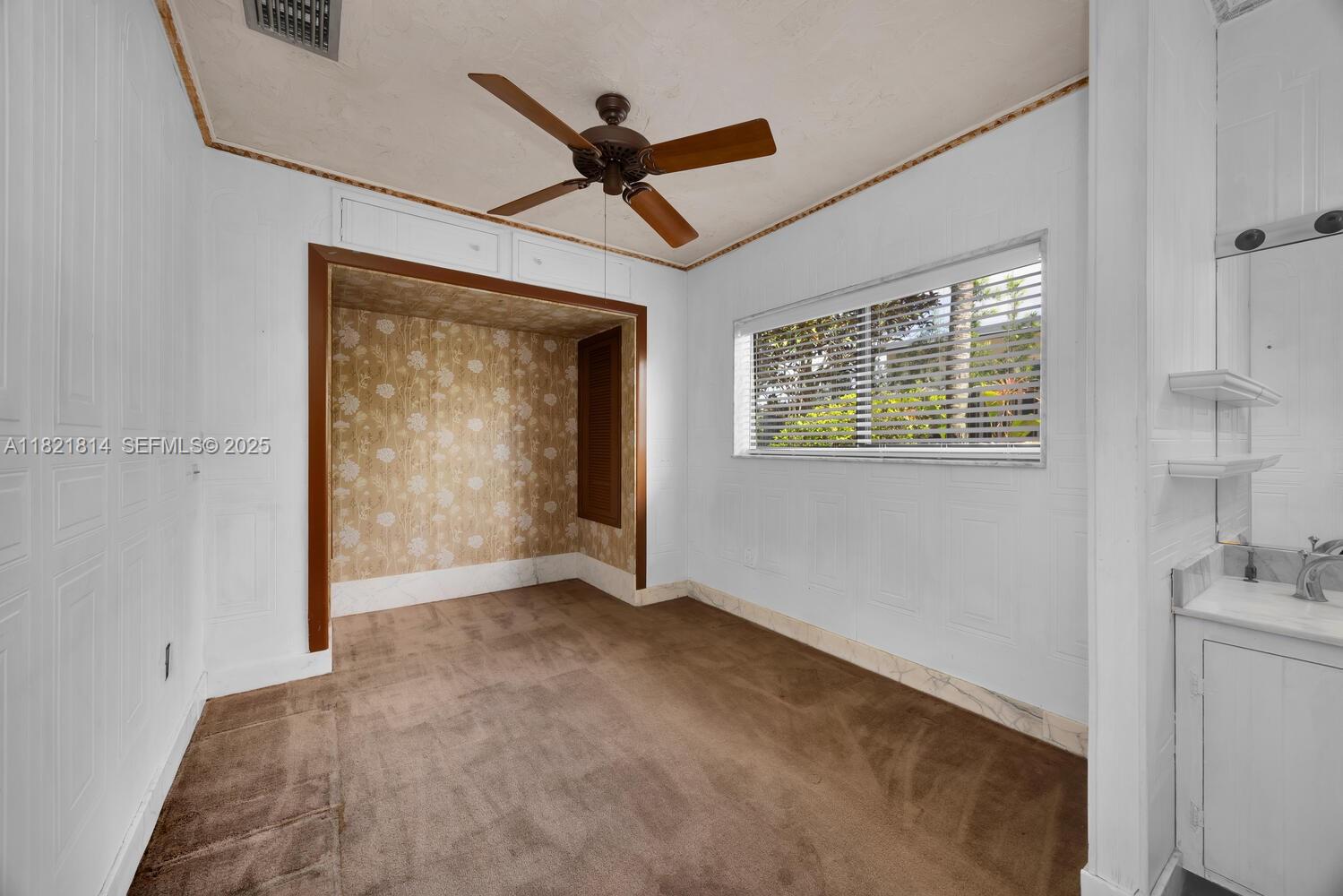 5025 Southwest 90th Court Miami, FL 33165 - Photo 13 of 18 a view of an empty room with a window