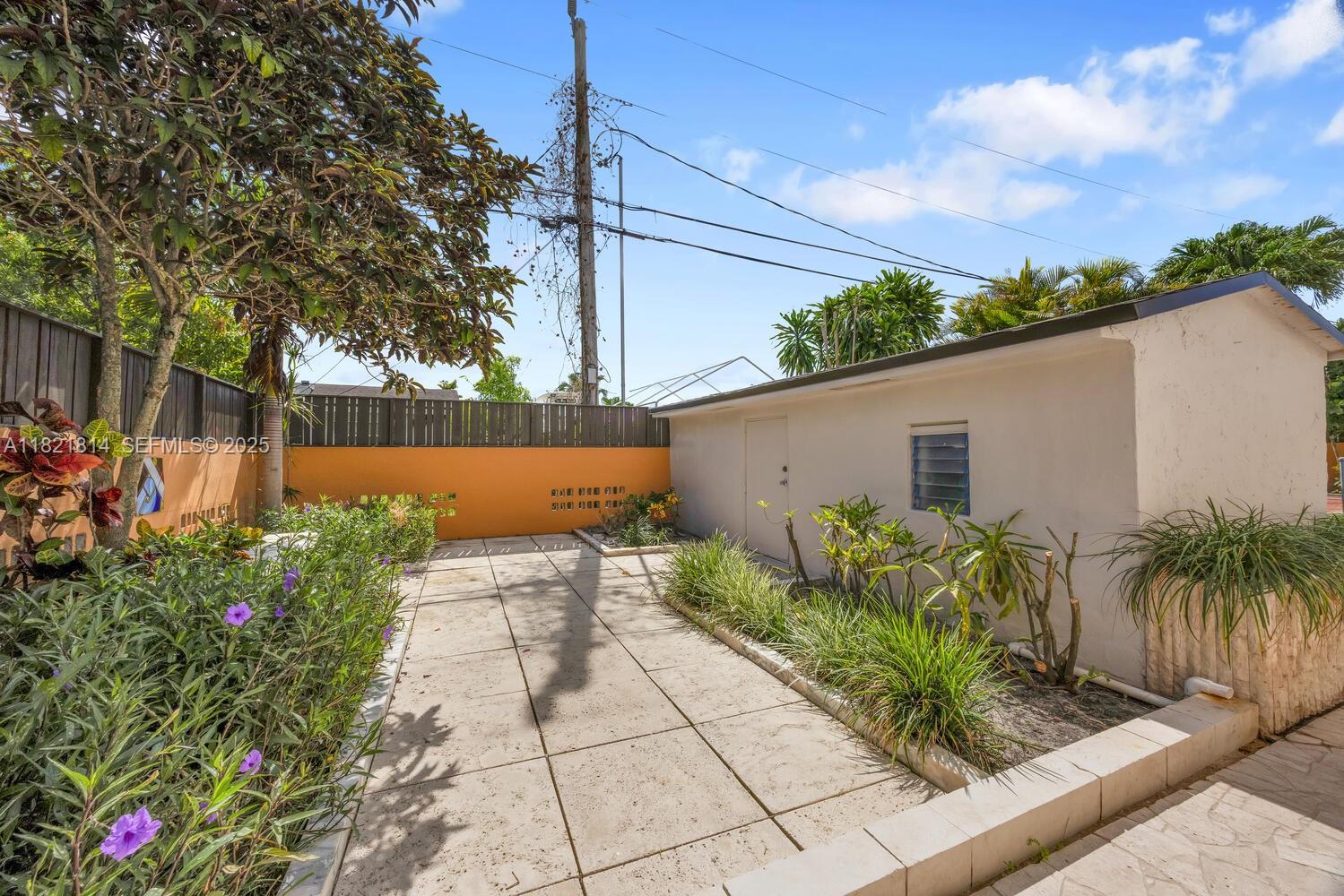 5025 Southwest 90th Court Miami, FL 33165 - Photo 17 of 18 a view of a backyard with plants