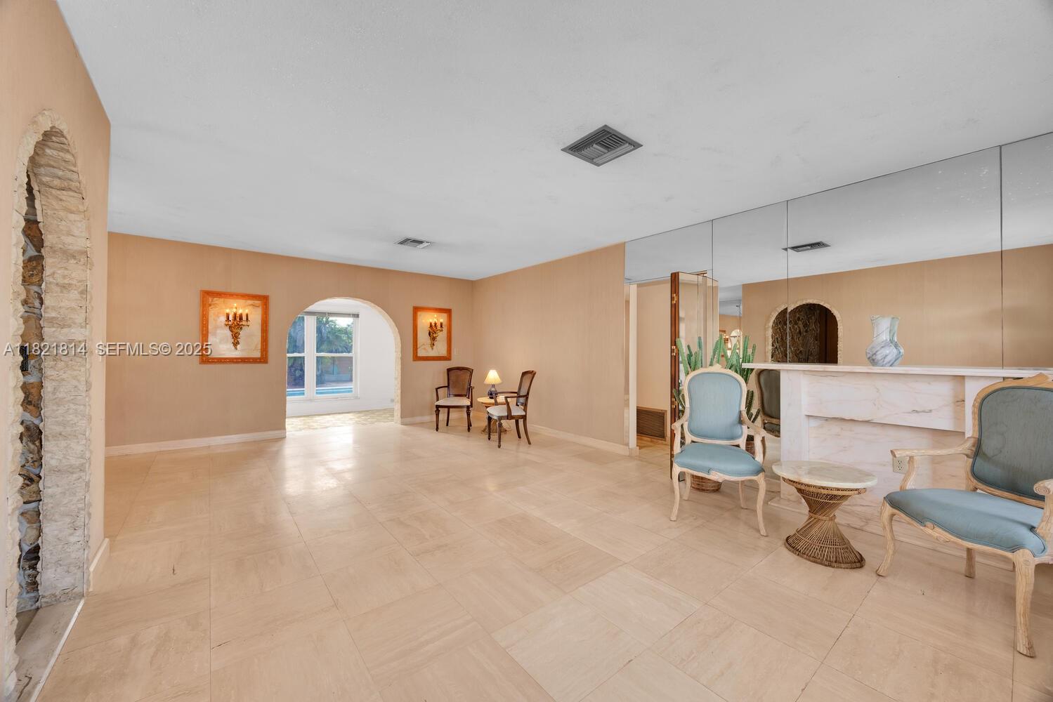 5025 Southwest 90th Court Miami, FL 33165 - Photo 3 of 18 a view of a livingroom with furniture and window