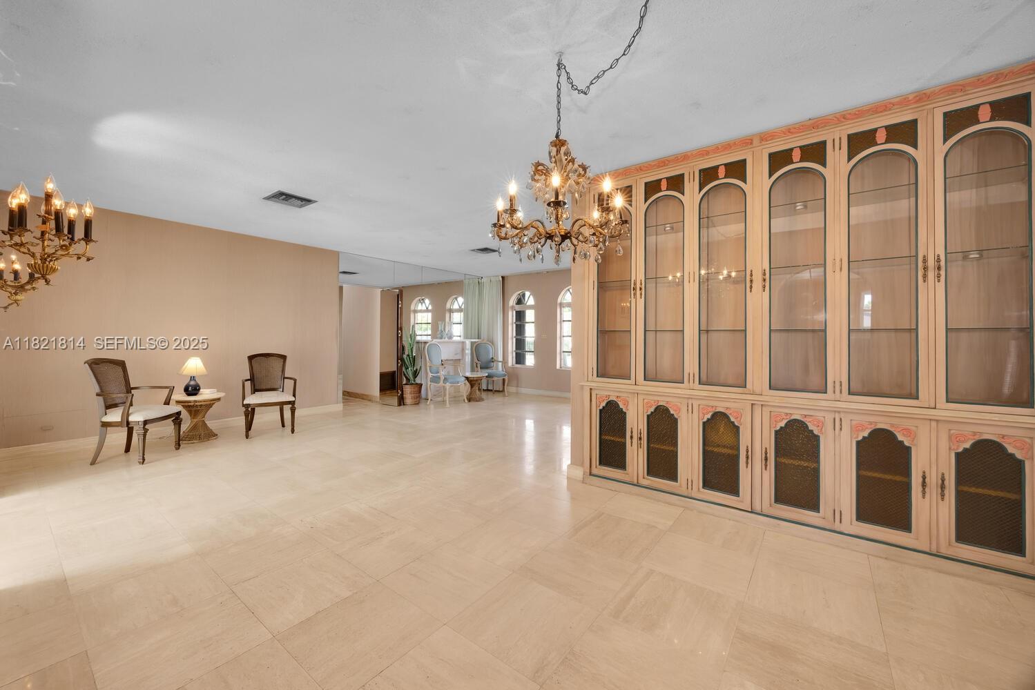 5025 Southwest 90th Court Miami, FL 33165 - Photo 5 of 18 a large white building with glass door