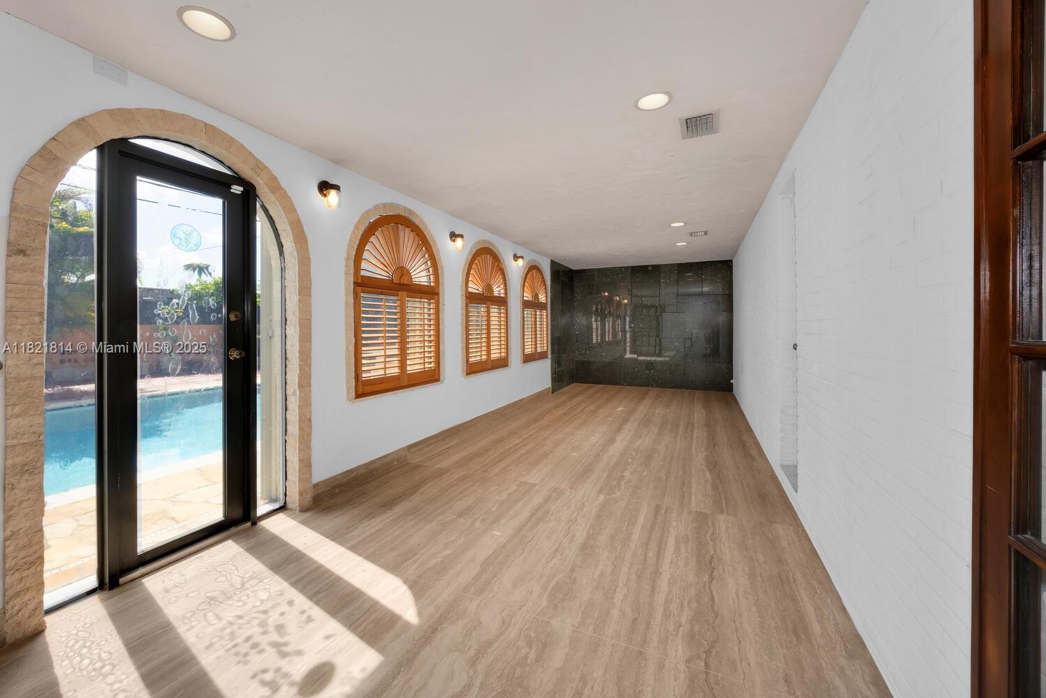 5025 Southwest 90th Court Miami, FL 33165 - Photo 6 of 18 a view of an empty room and a window