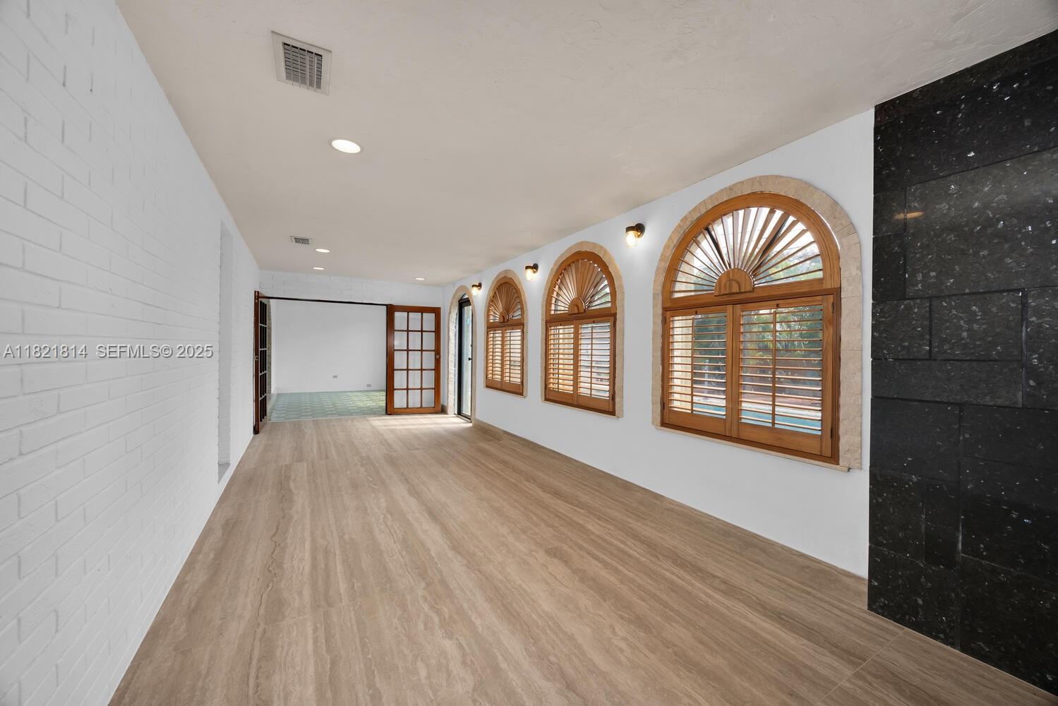 5025 Southwest 90th Court Miami, FL 33165 - Photo 7 of 18 a view of an empty room and window