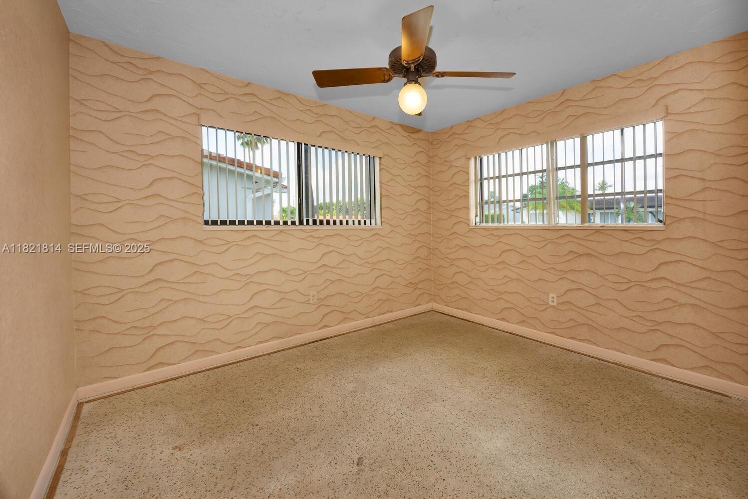 5025 Southwest 90th Court Miami, FL 33165 - Photo 10 of 18 a view of an empty room with a window