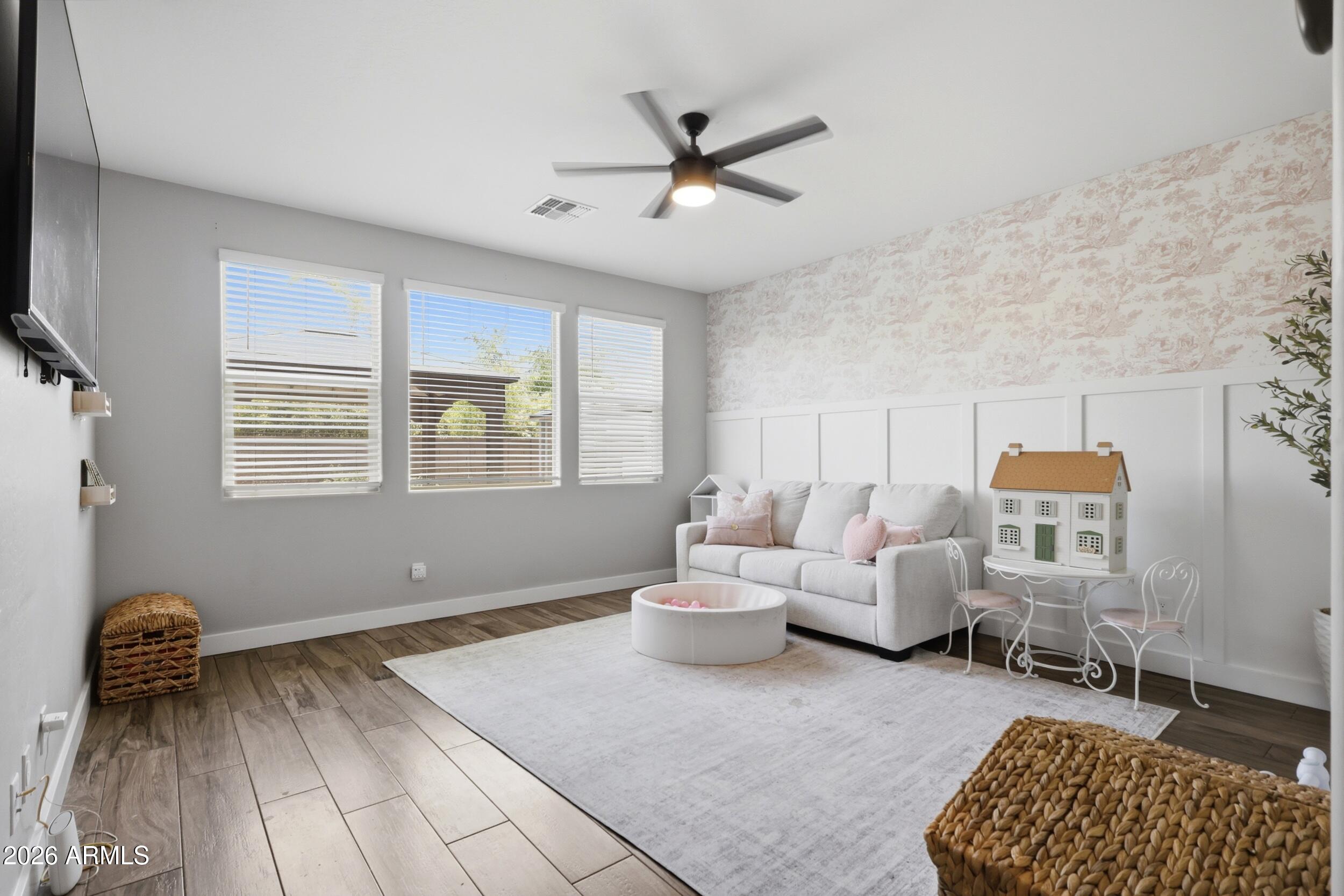12517 West Lawrence Road Glendale, AZ 85307 - Photo 35 of 52 a living room with furniture and a window