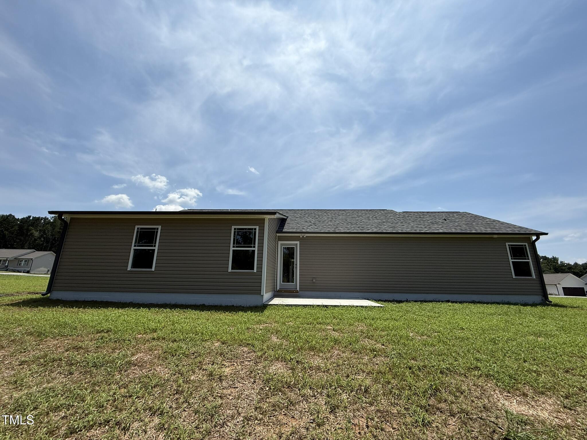 332 Magnolia Run Way Benson, NC 27504 - Photo 15 of 16 a front view of house with yard