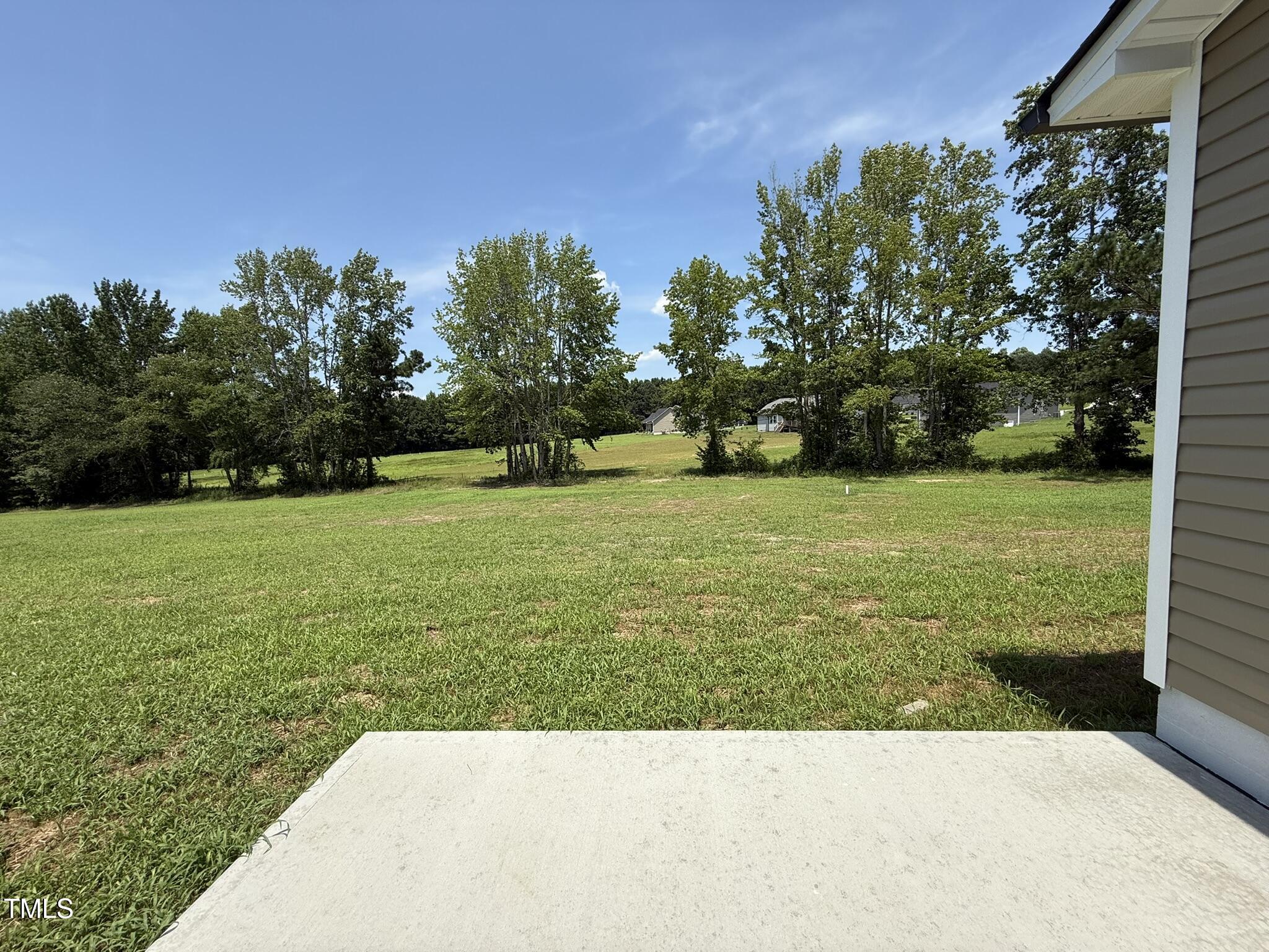 332 Magnolia Run Way Benson, NC 27504 - Photo 16 of 16 a view of a garden with trees