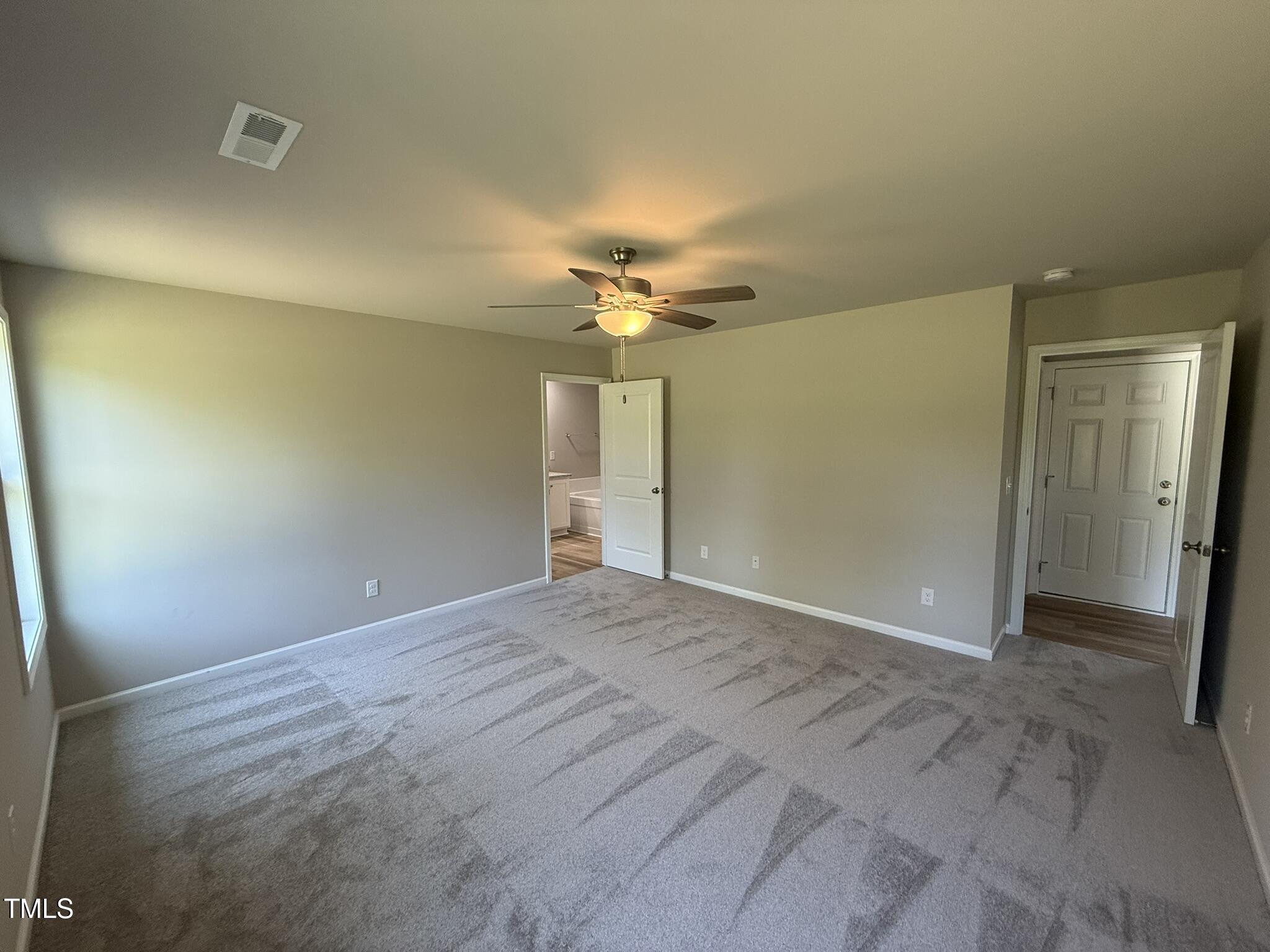 332 Magnolia Run Way Benson, NC 27504 - Photo 9 of 16 a view of a livingroom with a chandelier fan and hardwood floor