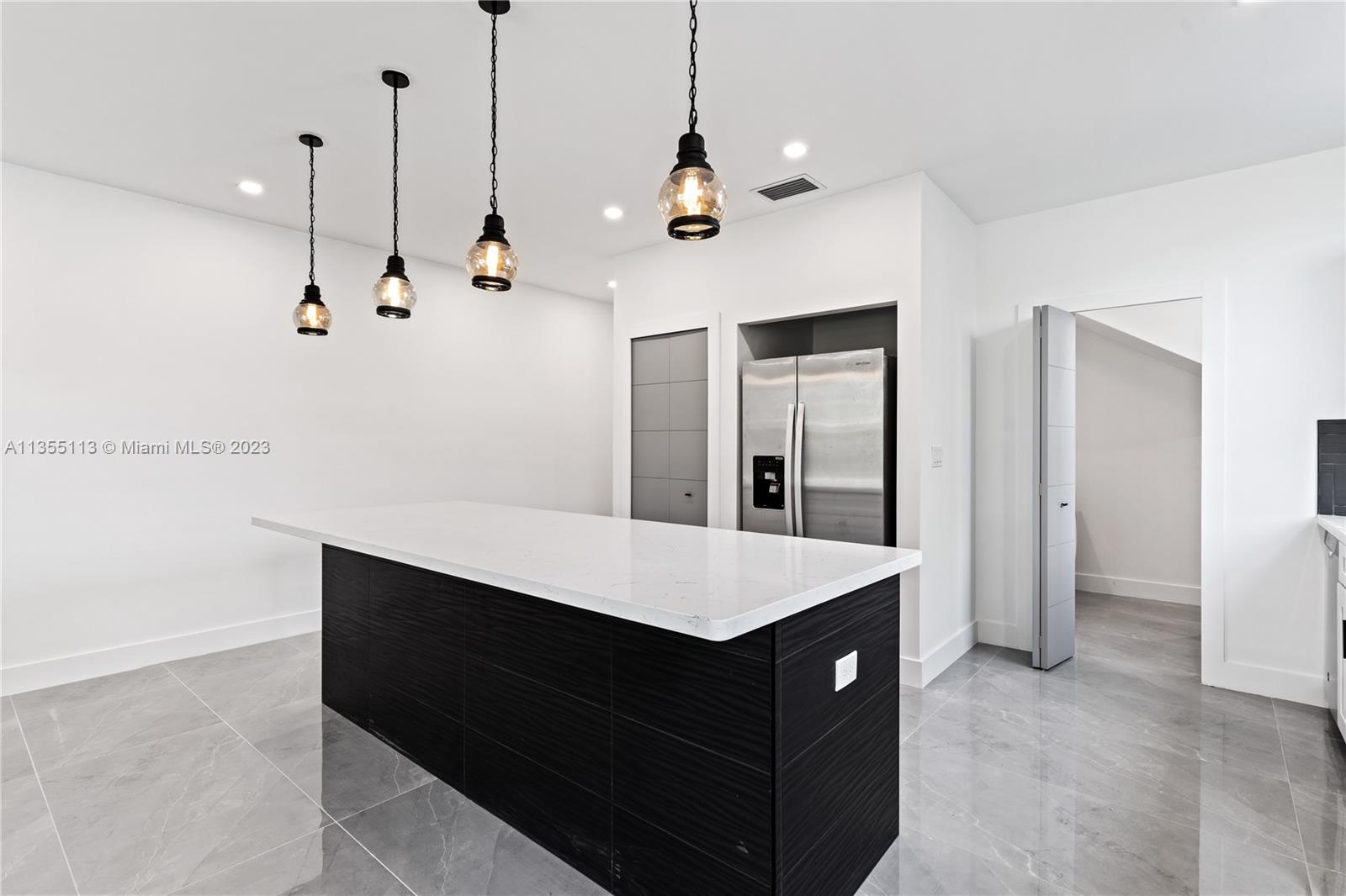 3617 Southwest 27th Street Miami, FL 33133 - Photo 14 of 29 a view of a room with stainless steel appliances