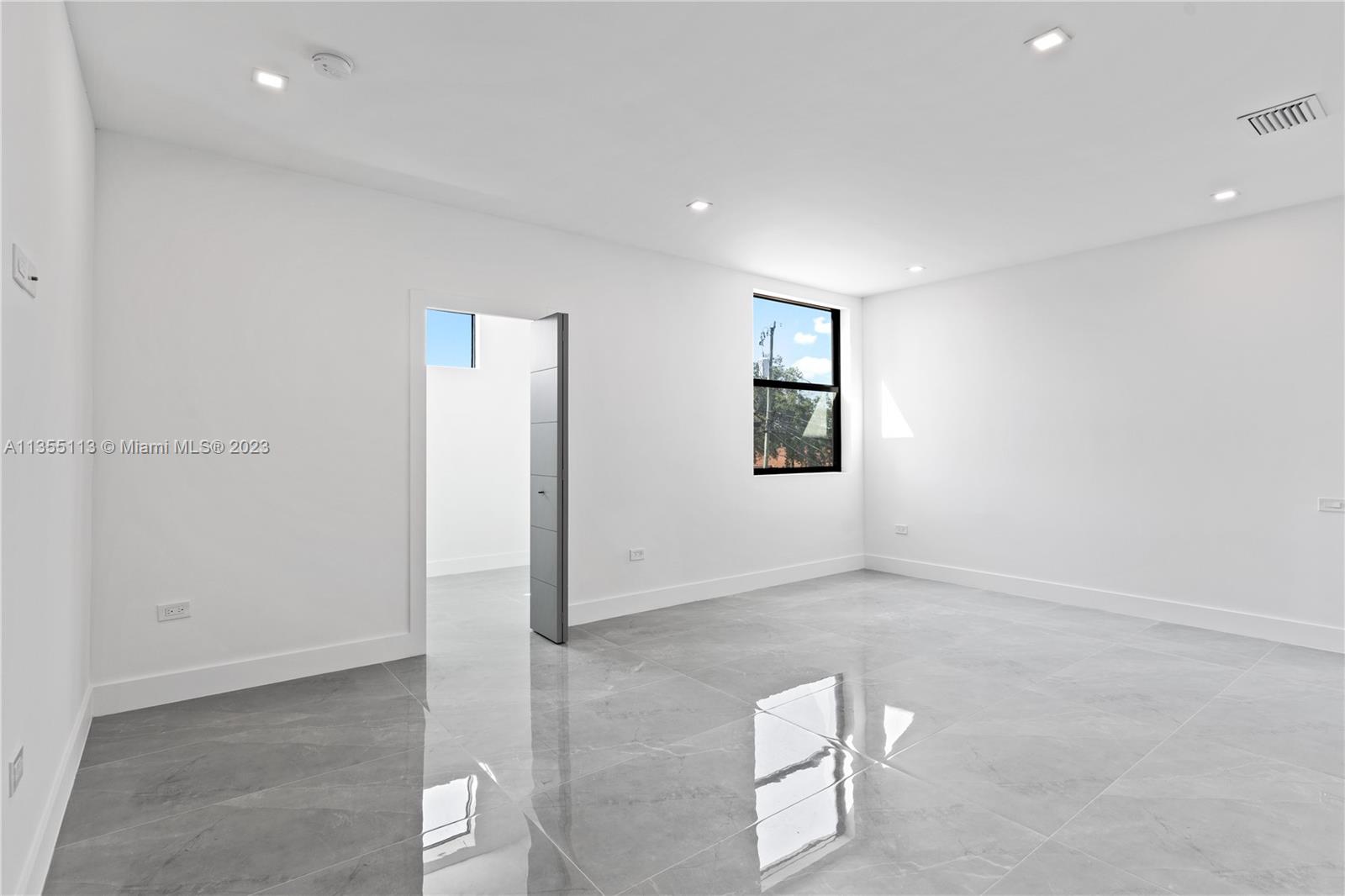 3617 Southwest 27th Street Miami, FL 33133 - Photo 22 of 29 an empty room with windows and closet