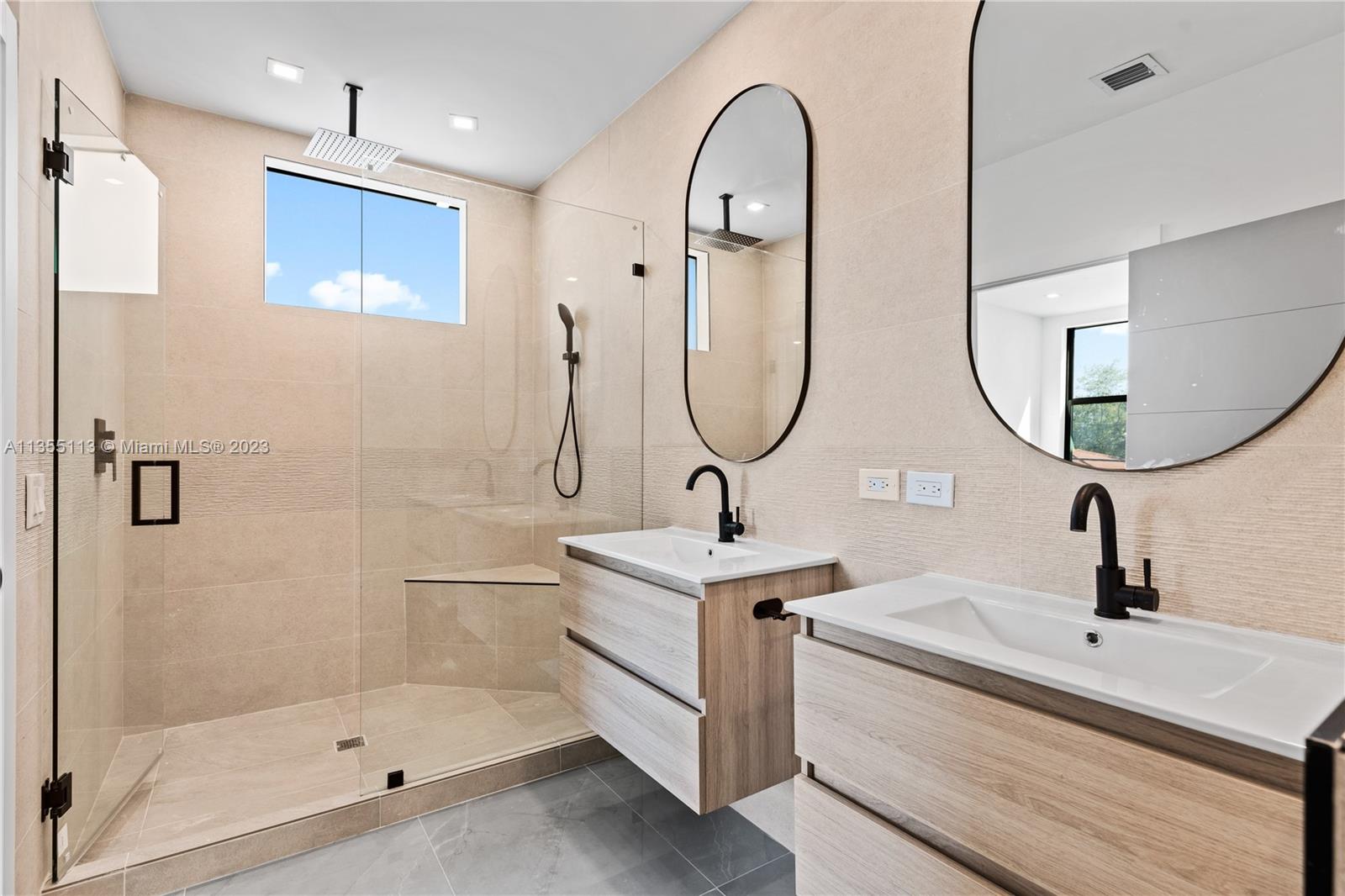 3617 Southwest 27th Street Miami, FL 33133 - Photo 24 of 29 a bathroom with a sink and a mirror