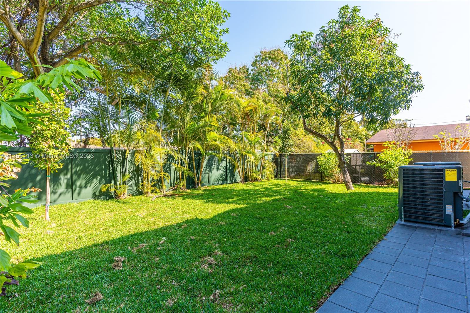 3617 Southwest 27th Street Miami, FL 33133 - Photo 28 of 29 a backyard of a house with a yard and plants