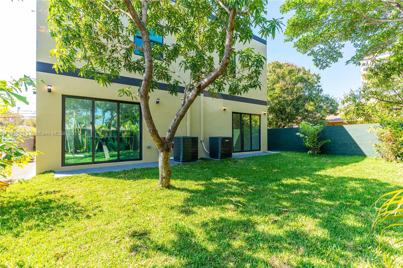 3617 Southwest 27th Street Miami, FL 33133 - Photo 29 of 29 a view of a house with backyard and a tree