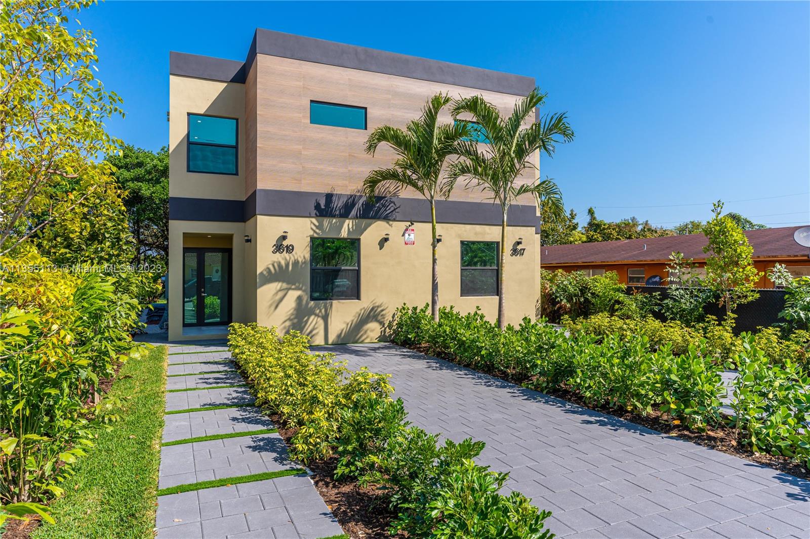 3617 Southwest 27th Street Miami, FL 33133 - Photo 3 of 29 a front view of a house with a yard