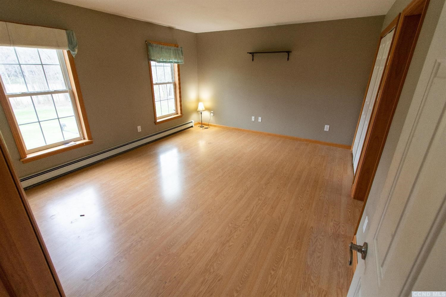 57 Waldorf Ridge Road Copake, NY 12516 - Photo 13 of 22 wooden floor in an empty room with a window