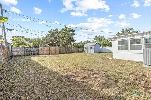 a view of backyard with green space