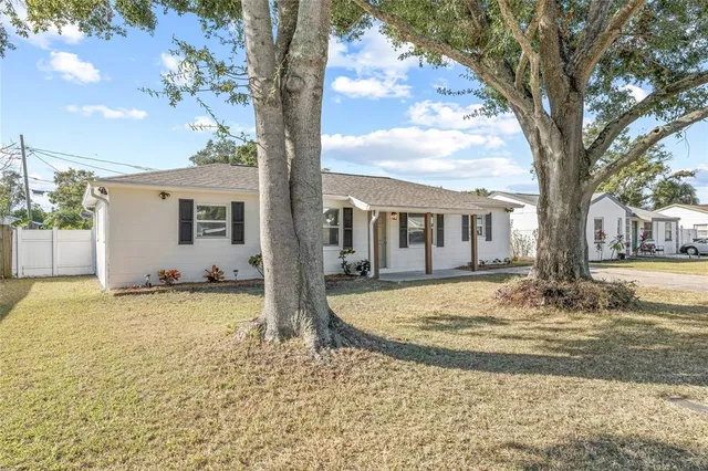 a view of a house with snow on the tree