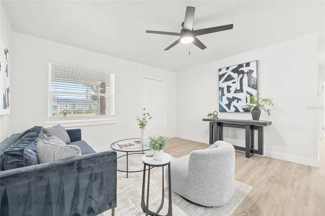 a living room with furniture and a window