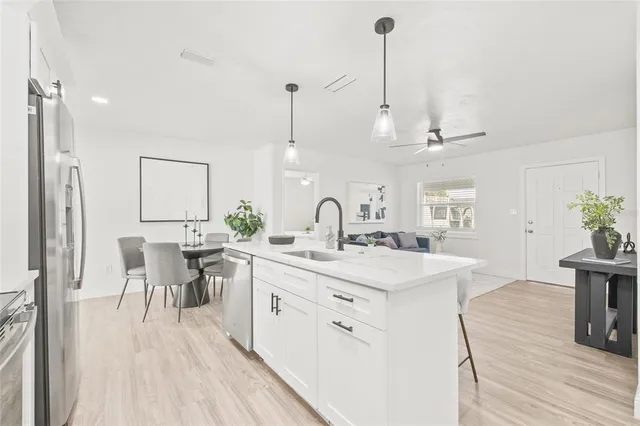 a very nice looking dining room with a table and chairs
