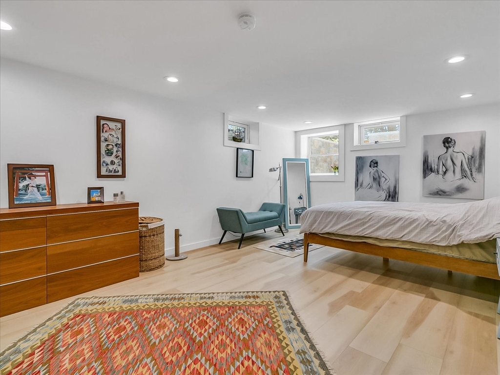 282 Atlantic Avenue Swampscott, MA 01907 - Photo 16 of 28 a bedroom with a bed and a dresser