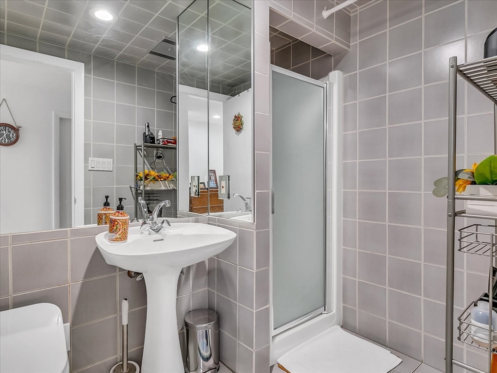 282 Atlantic Avenue Swampscott, MA 01907 - Photo 18 of 28 a bathroom with a sink toilet and shower