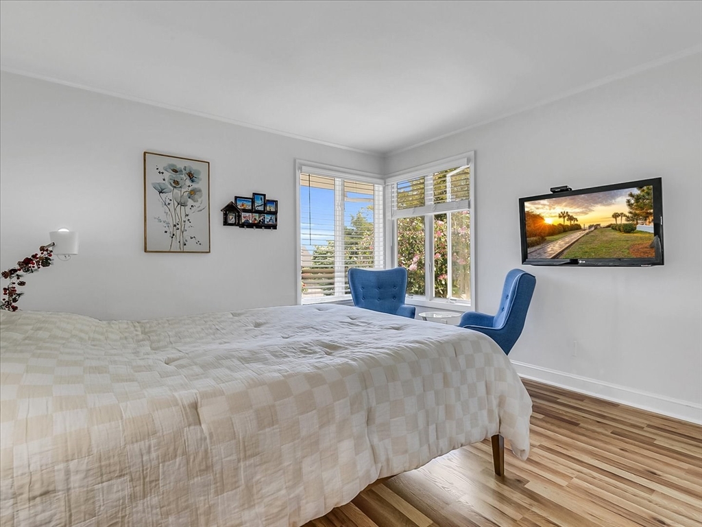 282 Atlantic Avenue Swampscott, MA 01907 - Photo 22 of 28 a bedroom with a bed and a flat screen tv