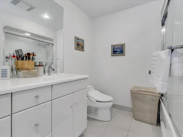 a bathroom with a toilet a sink and a bathtub