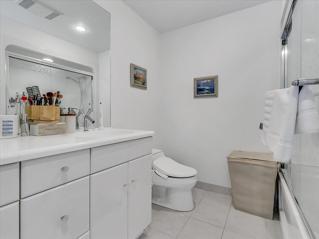282 Atlantic Avenue Swampscott, MA 01907 - Photo 27 of 28 a bathroom with a sink toilet and a mirror