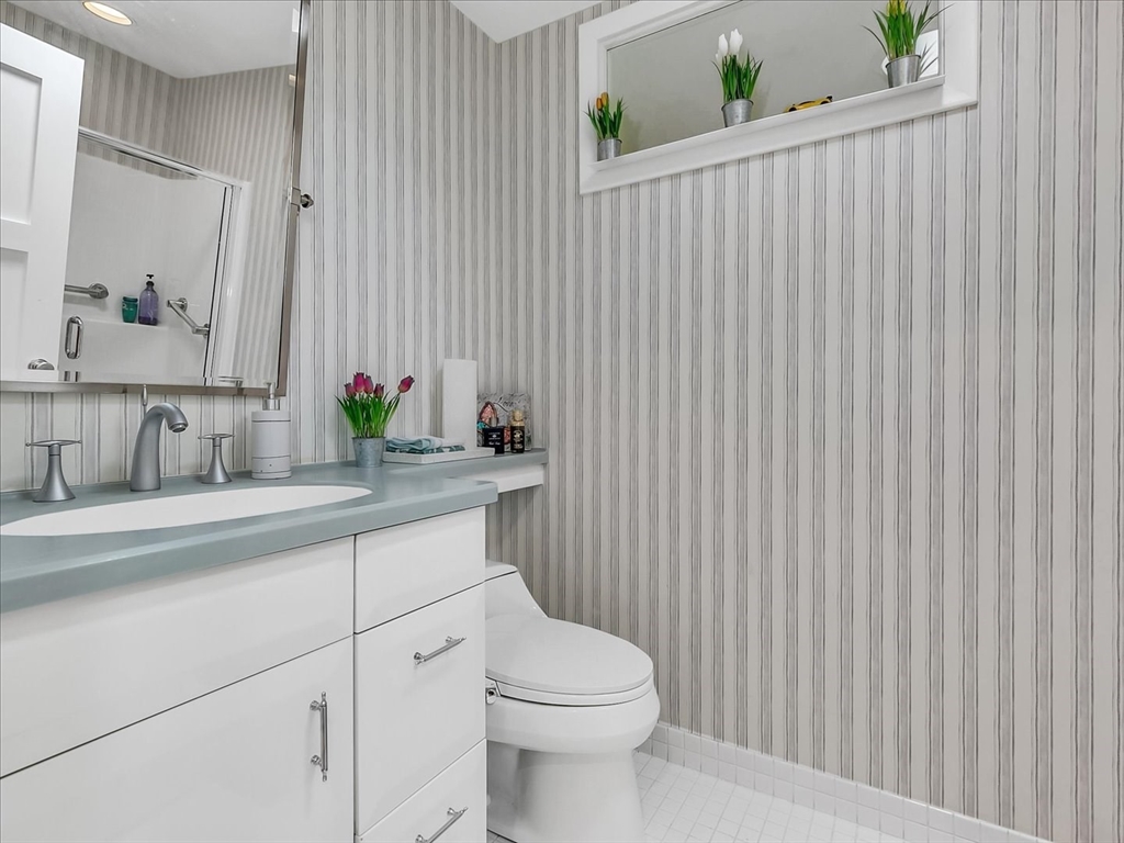 282 Atlantic Avenue Swampscott, MA 01907 - Photo 28 of 28 a bathroom with a toilet a sink and a bathtub