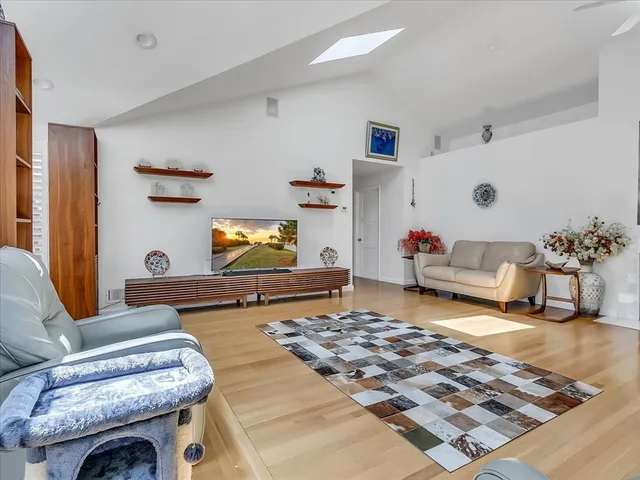 a living room with furniture and a rug