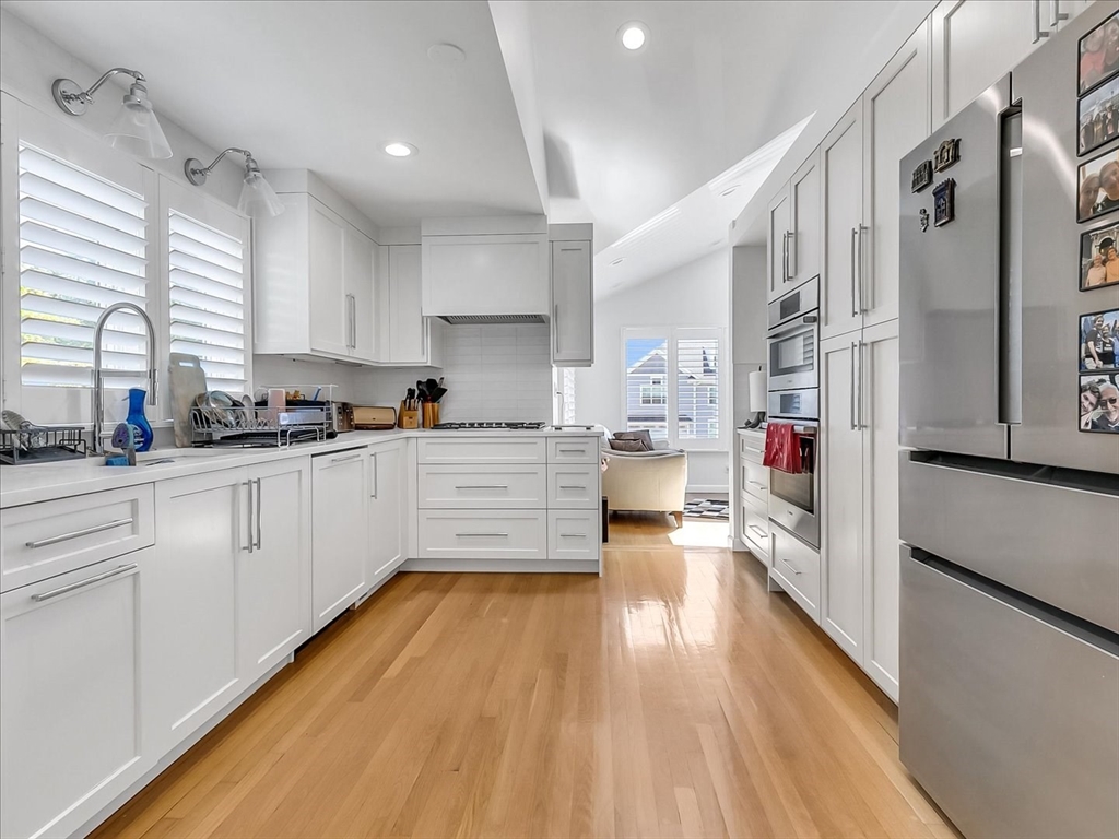 282 Atlantic Avenue Swampscott, MA 01907 - Photo 8 of 28 a kitchen with stainless steel appliances a refrigerator sink and cabinets
