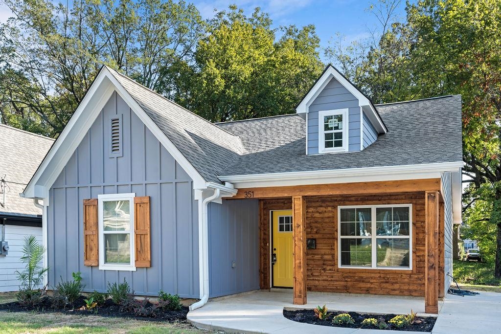 351 Edith Avenue Memphis, TN 38126 - Photo 2 of 15 View of front of home featuring board and batten siding, a porch, and a shingled roof