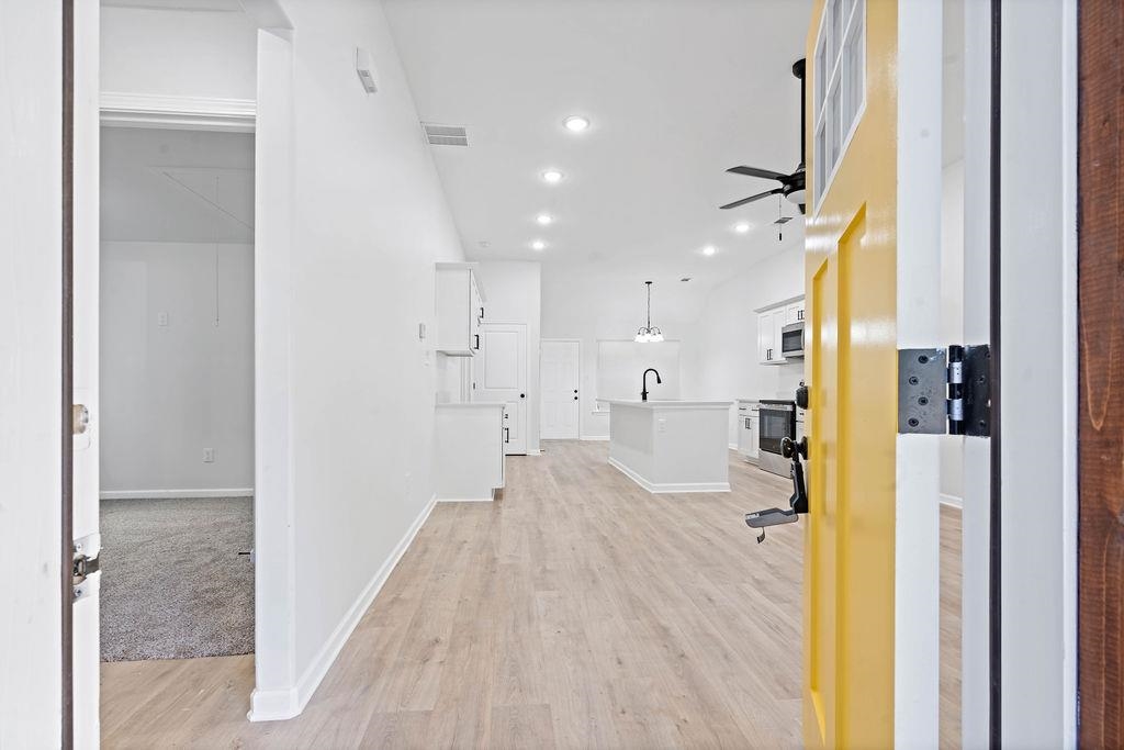 351 Edith Avenue Memphis, TN 38126 - Photo 3 of 15 Hallway featuring light wood-style floors, recessed lighting, and lofted ceiling