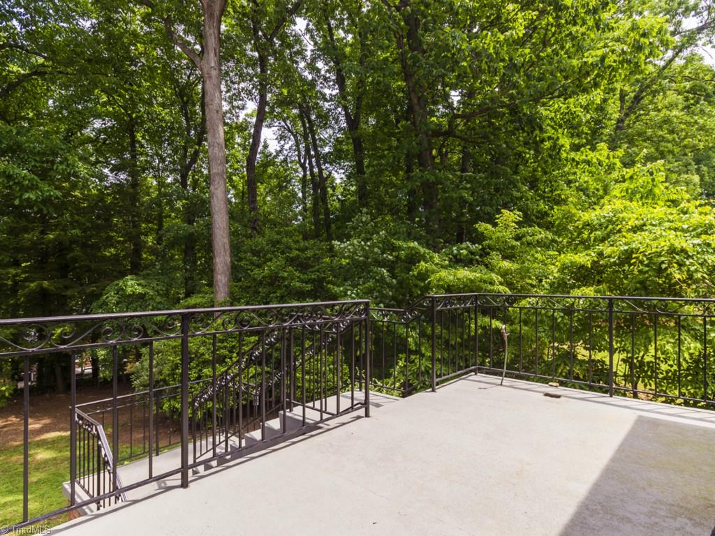 3612 Pinetop Road Greensboro, NC 27410 - Photo 27 of 30 Serene wooded views from your upper concrete patio!