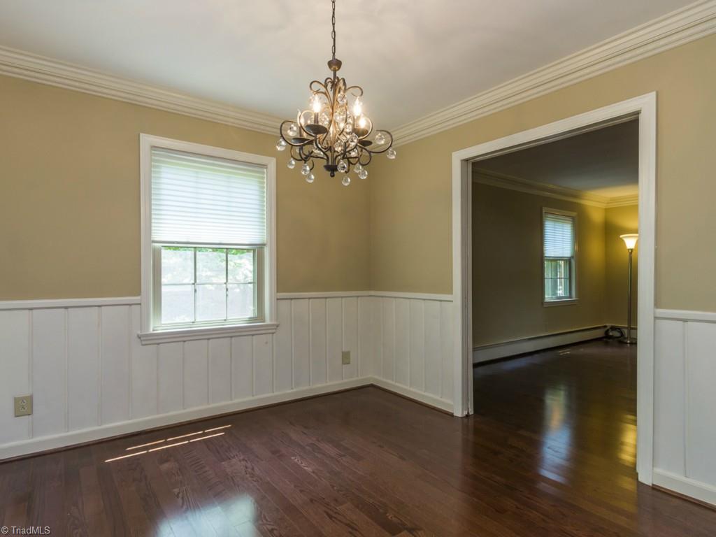 3612 Pinetop Road Greensboro, NC 27410 - Photo 5 of 30 Step into your Dining Room which is adjacent to the completely updated kitchen with granite and backsplash!