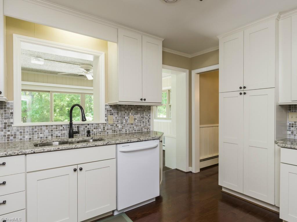 3612 Pinetop Road Greensboro, NC 27410 - Photo 7 of 30 Gorgeous, bright and interesting - with a decadent view of the outdoors from your kitchen sink.