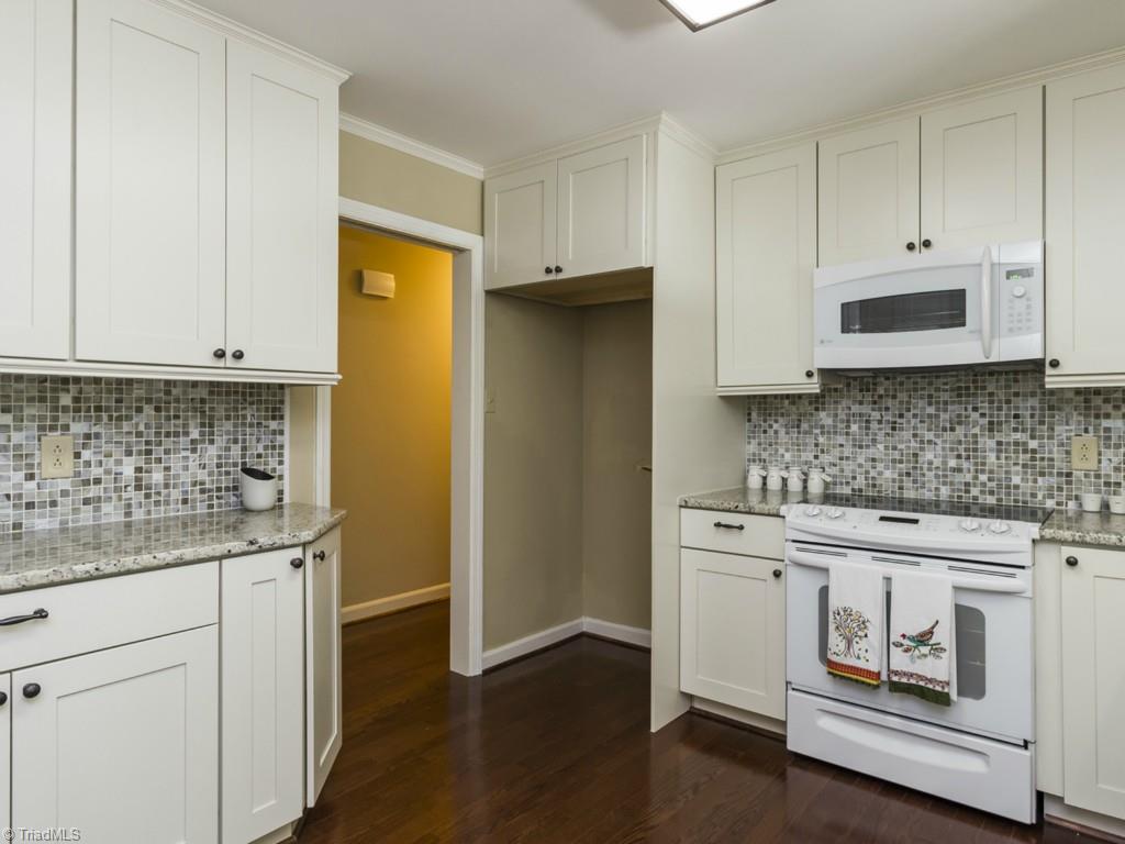 3612 Pinetop Road Greensboro, NC 27410 - Photo 9 of 30 Another view fo the kitchen to show layout and the above-range microwave saving you counterspace!