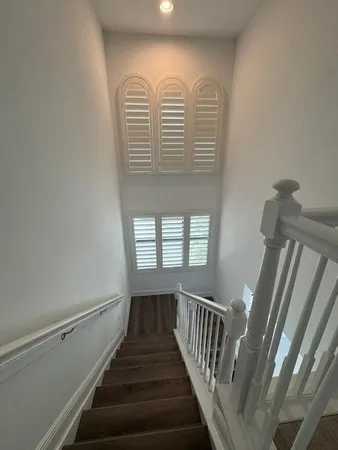 a view of entryway with stairs and wooden floor